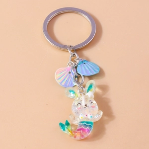 Detail of bunny mermaid keychain with transparent resin, colorful sequins and silver ring
