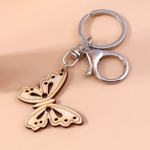 Fashionable laser-cut wooden butterfly keychain with elegant hollow patterns and metal clasp