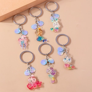 Glittery ocean resin keychain set with octopus mermaid jellyfish and shell charms