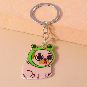 Detailed view of pug dog keychain with green frog hat and silver metal ring