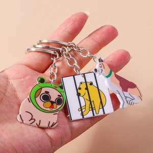 Three cute acrylic cartoon dog keychains with silver rings and bright colors