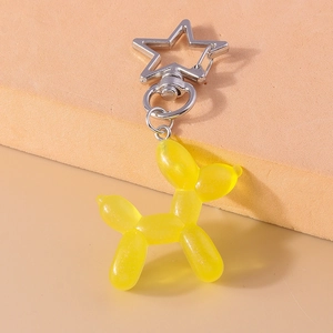 Vista dettagliata portachiavi cane palloncino giallo traslucido con gancio a stella
