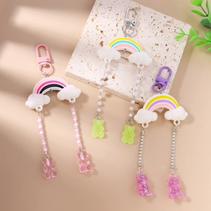 Rainbow cloud bear keychain charms in pink, yellow and purple for bags and backpacks