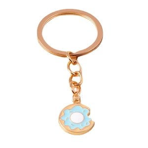 Portachiavi a forma di ciambella blu cielo con base dorata e dettaglio morso su bianco