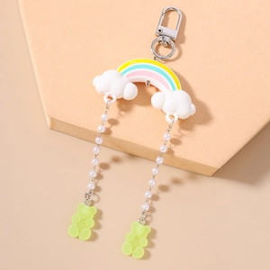 Rainbow keychain detail with pearl chains and translucent green gummy bear charms