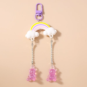 Detail of rainbow bear keychain with purple resin charms and sparkling rhinestone chains