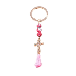 Evil eye cross keychain with red marble beads and pink silk tassel on gold ring