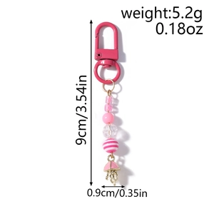 Pink beaded keychain with jellyfish pendant and dimension markers for length and weight
