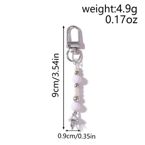 Detail of beaded keychain with mushroom pendant showing dimensions and 4.9g weight