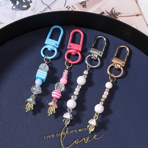 Striped beaded keychain set with pearl tassel and metal octopus pendants for bags