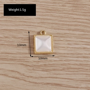 Detailed view of 13mm gold framed cat eye stone pendant with size and weight specs