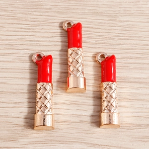 Lipstick shaped jewelry pendants with red enamel and gold textured metal base