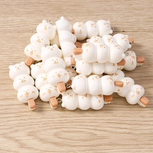 Macro detail of bear-shaped resin food charms for DIY jewelry and keychain making