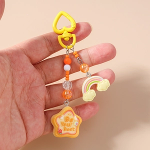 Detailed shot of rainbow keychain with beads and a Be Your Best star pendant