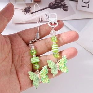 Fashionable butterfly phone charm set with green faceted beads and floral resin details