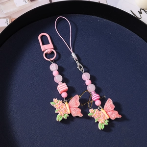 Detail of pink gradient butterfly and flower beads with metal D-ring and lanyard cord