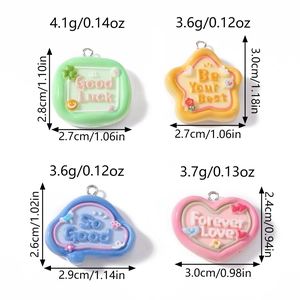 Detail of colorful resin charms in heart and star shapes with inspirational quotes