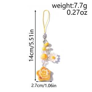 Detail view of yellow beaded phone charm with daisy and star pendant showing dimensions