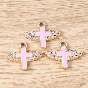 Detail of pink enamel angel wing cross pendants with gold plating for DIY jewelry making
