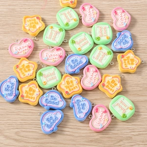 DIY colorful heart and star resin charms with motivational text for jewelry making