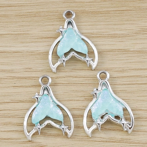 Three gradient blue mermaid tail charms with silver star details for DIY jewelry making