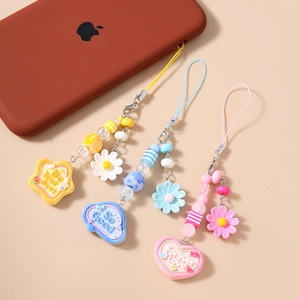 Three-piece beaded phone charms with daisy flower, stars and hearts in colorful resin beads