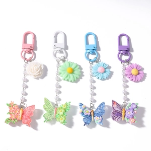 Fashionable floral and butterfly keychain set with pearl chain in four vibrant colors