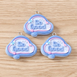 Detail view of cloud-shaped resin pendants with So Good text for DIY jewelry making