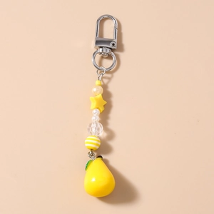 Detailed view of handmade beaded keychain featuring yellow star and pear fruit pendant