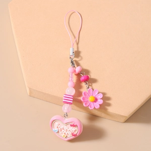 Detailed view of pink beaded phone charm with Forever Love heart and daisy pendants