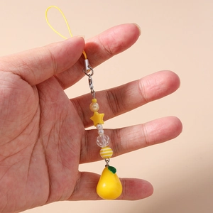Detail of yellow star beaded phone charm with star beads and a pear-shaped pendant