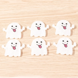 Detailed view of six white acrylic ghost charms for DIY Halloween jewelry and keychains