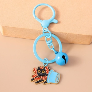 Close-up of blue lobster clasp keychain with black cat enamel pendant and round bell