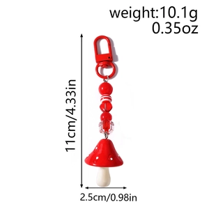 Detail showing dimensions of red mushroom keychain with striped beads and lobster clasp