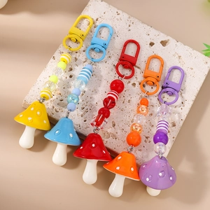 Fashionable beaded mushroom keychains with colorful striped beads and metal carabiners