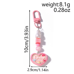 Close-up of pink heart keychain with Forever Love inscription and striped pearl beads