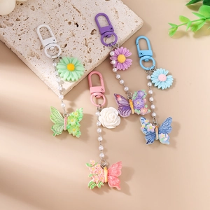 Schicker Gänseblümchen und Rosen Schlüsselanhänger mit Schmetterling für Handtaschen