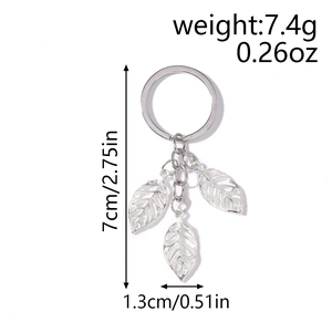 Detailed view of silver leaf keychain with dimensions showing 7cm length and 7.4g weight