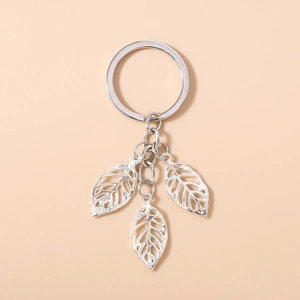 Silver hollow leaf keychain with triple pendants and polished metal ring for bags