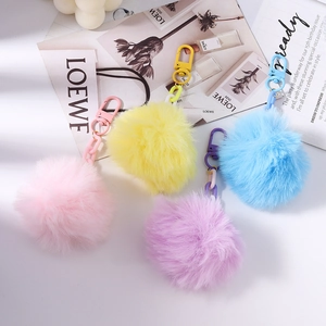 Porte-clés chics en fausse fourrure de lapin en couleurs pastel rose, jaune et bleu clair