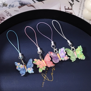 Exquisite butterfly phone charms set in blue, pink, purple, and green resin with floral carving