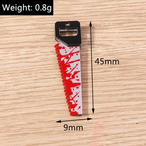 Detailed view of Halloween saw charm with blood splatters measuring 45mm and weighing 0.8g