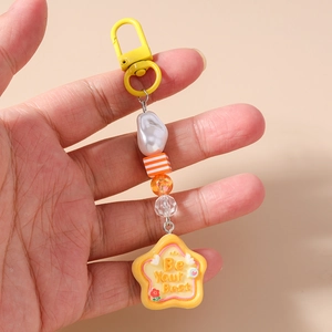Beaded keychain with striped cubes and star charm engraved with Be Your Best quote