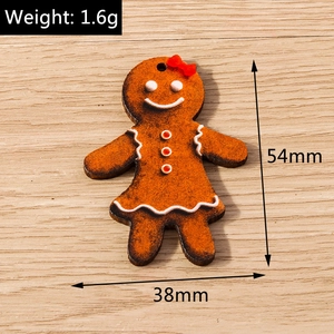 Detail view of gingerbread man charm with size marks 54mm by 38mm for DIY jewelry