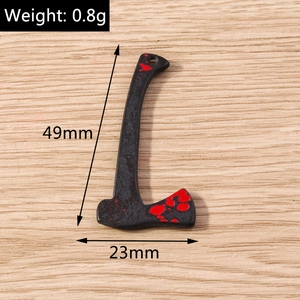 Detailed view of axe charm with blood splatter and dimensions of 49mm by 23mm