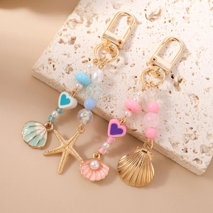 Starfish and seashell beaded keychain with heart charms and golden lobster clasp