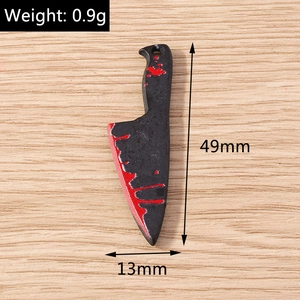 Detail view of 49mm horror kitchen knife pendant with red blood splatter finish