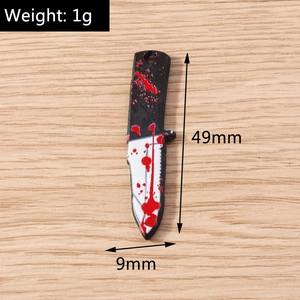 Detailed macro view of a bloody knife charm for Halloween DIY jewelry making with dimensions