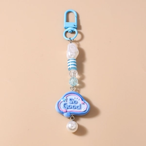 Detail view of sky blue beaded keychain with 'So Good' cloud charm and faux pearl