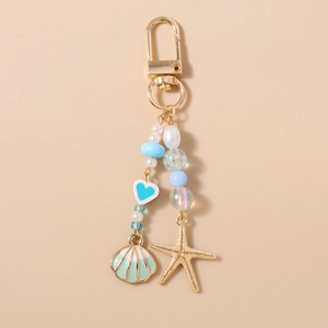 Detail of ocean-themed keychain with starfish, seashell pendants and colorful beads